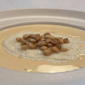 white porridge with bread, egg,sausage and baked beans.